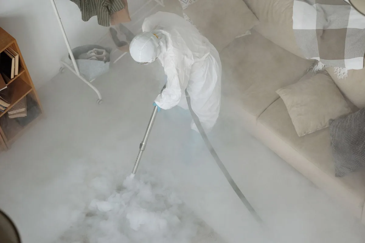 Biohazard cleanup technician in protective equipment, East Pasadena, CA